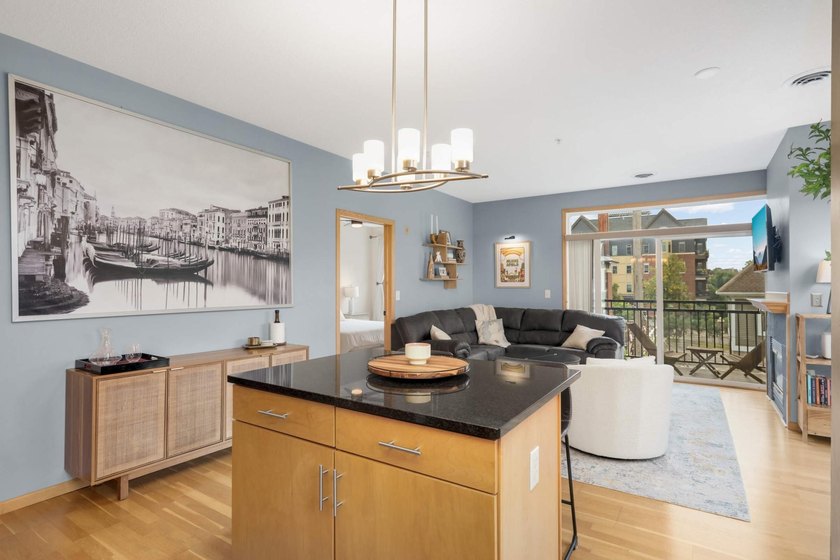 This beautifully updated end-unit condo is filled with natural - photo 11