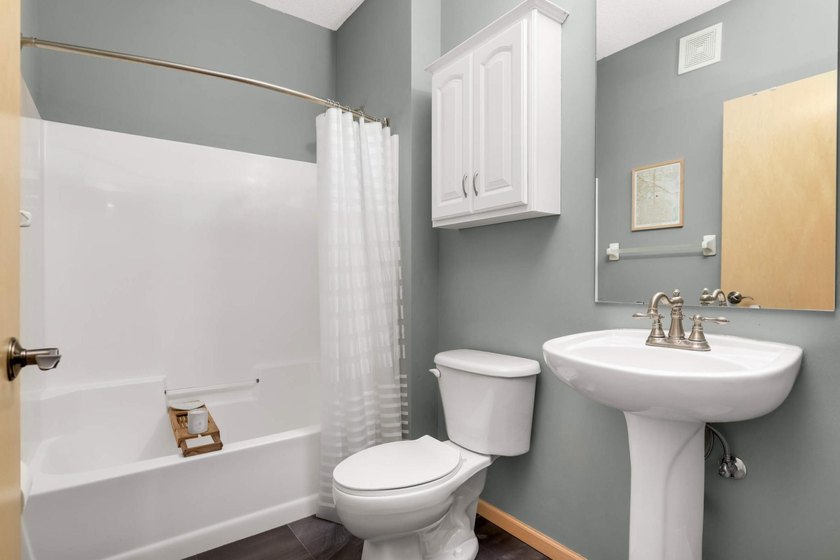 This beautifully updated end-unit condo is filled with natural - photo 22