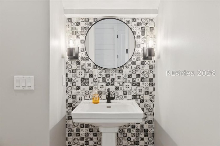 Step into a truly exceptional marshfront retreat where modern - photo 34