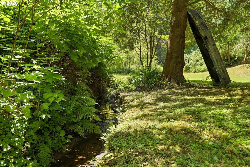 Tucked away at the end of a private driveway, this secluded and - photo 5