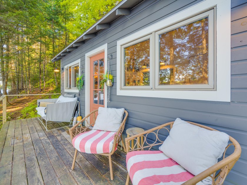 Set along approximately 150 feet of pristine shoreline on the - photo 13