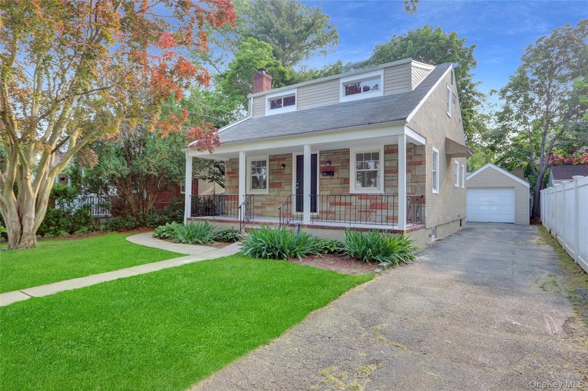 Outstanding and updated Cape Cod style home with gorgeous curb - photo 3