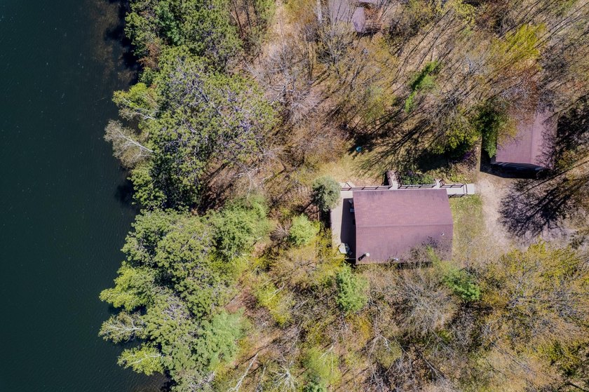 Nestled on a wooded lot on beautiful 204 AC BOOTH lake, this - photo 13