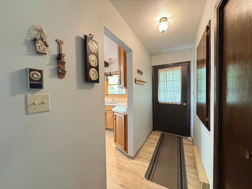 Nestled on a wooded lot on beautiful 204 AC BOOTH lake, this - photo 15
