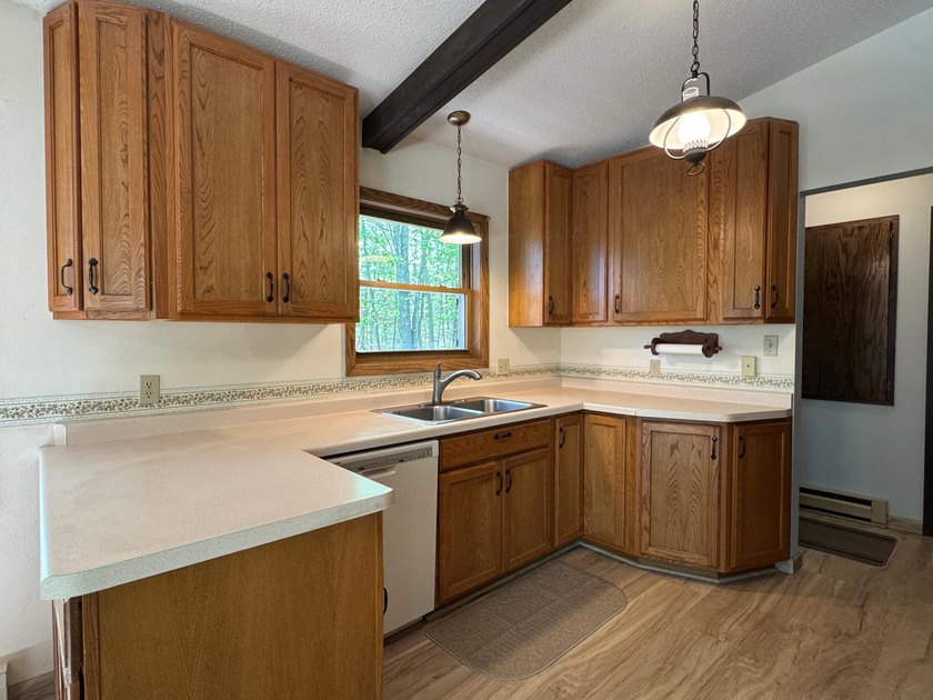 Nestled on a wooded lot on beautiful 204 AC BOOTH lake, this - photo 17
