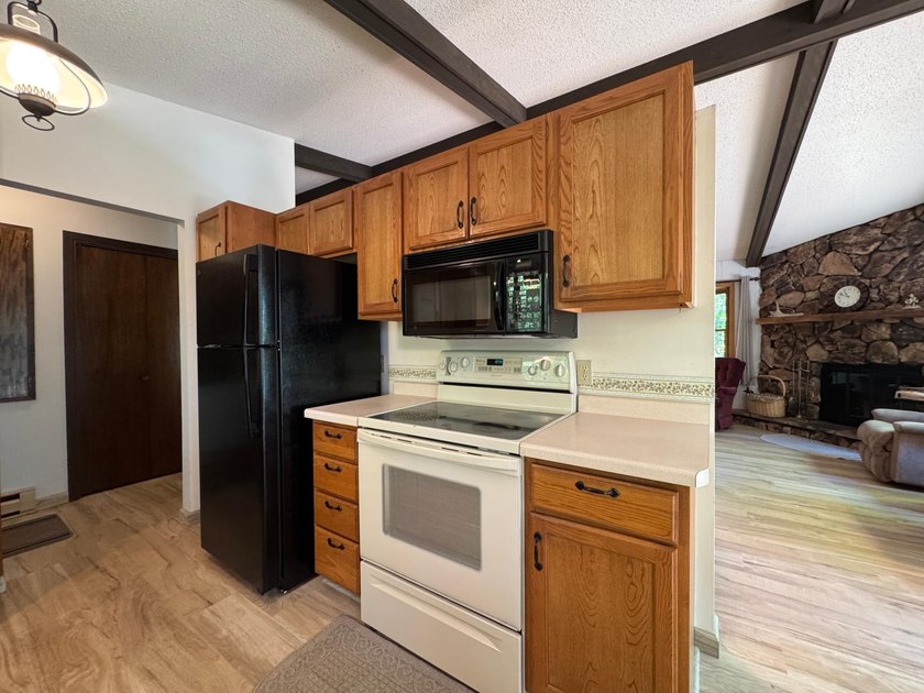 Nestled on a wooded lot on beautiful 204 AC BOOTH lake, this - photo 18