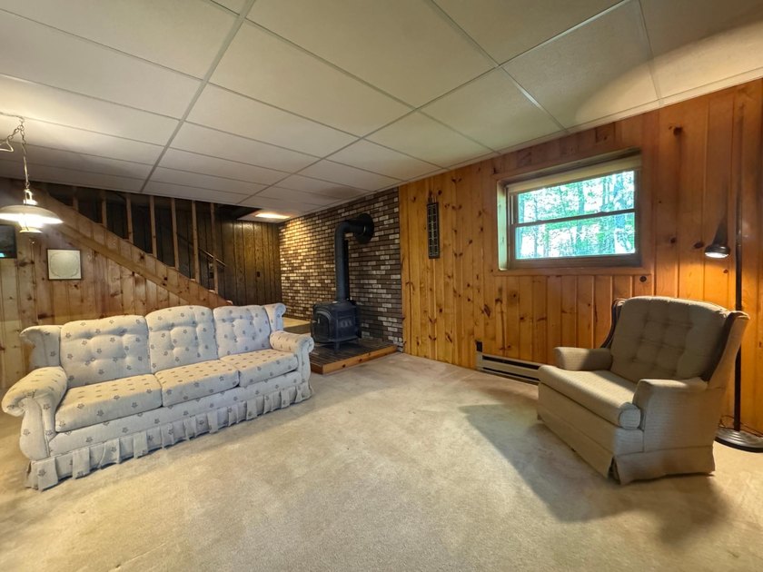 Nestled on a wooded lot on beautiful 204 AC BOOTH lake, this - photo 24