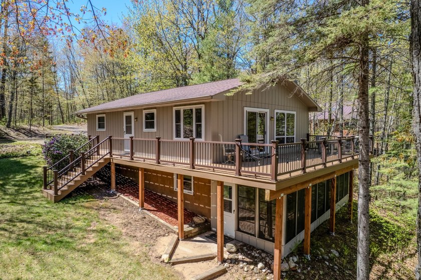 Nestled on a wooded lot on beautiful 204 AC BOOTH lake, this - photo 30