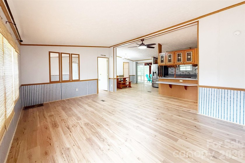Nestled on a breathtaking 1.29-acre lakefront lot, this - photo 3