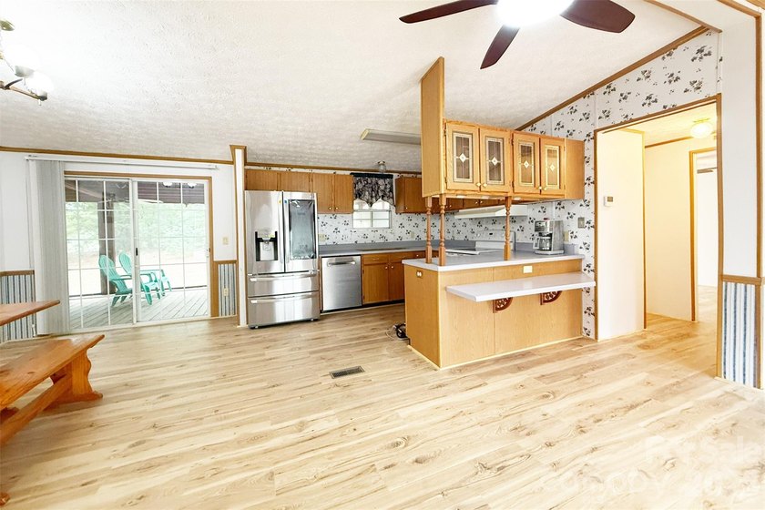Nestled on a breathtaking 1.29-acre lakefront lot, this - photo 5