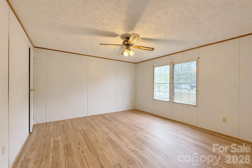 Nestled on a breathtaking 1.29-acre lakefront lot, this - photo 10