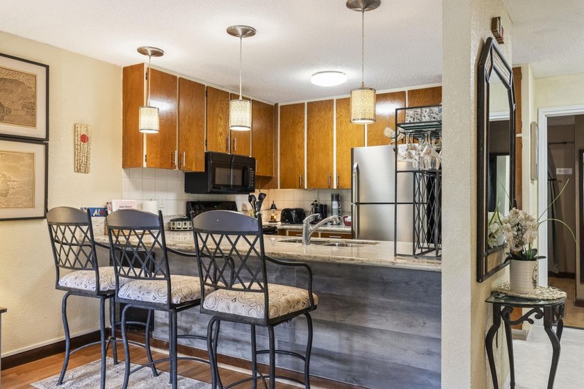Welcome to Kihei Resort #105, a charming ground-floor condo in a - photo 12