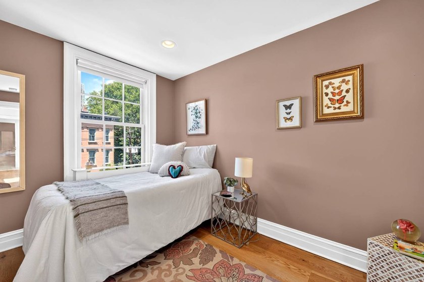 This exceptional 25-foot-wide single-family brownstone sits in - photo 32