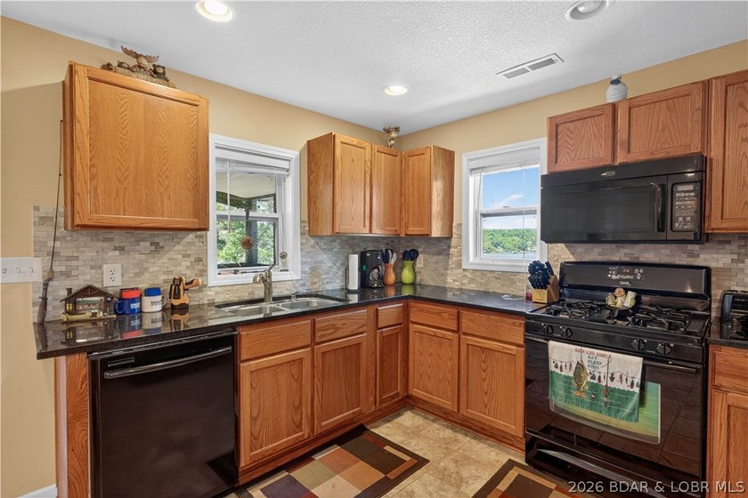 Take a look at this beautiful 4-bedroom, 2-bath home at the Lake - photo 15