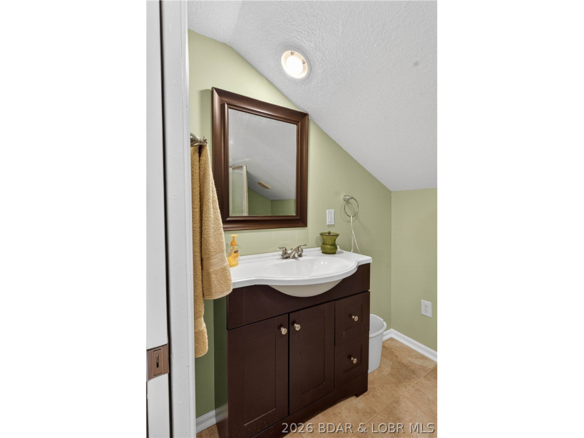 Take a look at this beautiful 4-bedroom, 2-bath home at the Lake - photo 41