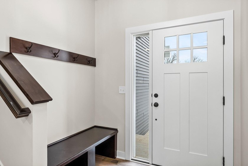This stunning two-story new construction offers a perfect blend - photo 2