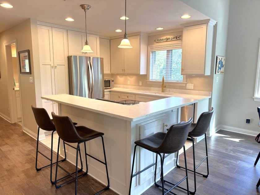 Experience exceptional Northwoods lakefront living with this - photo 15