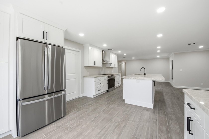 Fully remodeled 3-bedroom, 2-bath home with an attached garage - photo 12