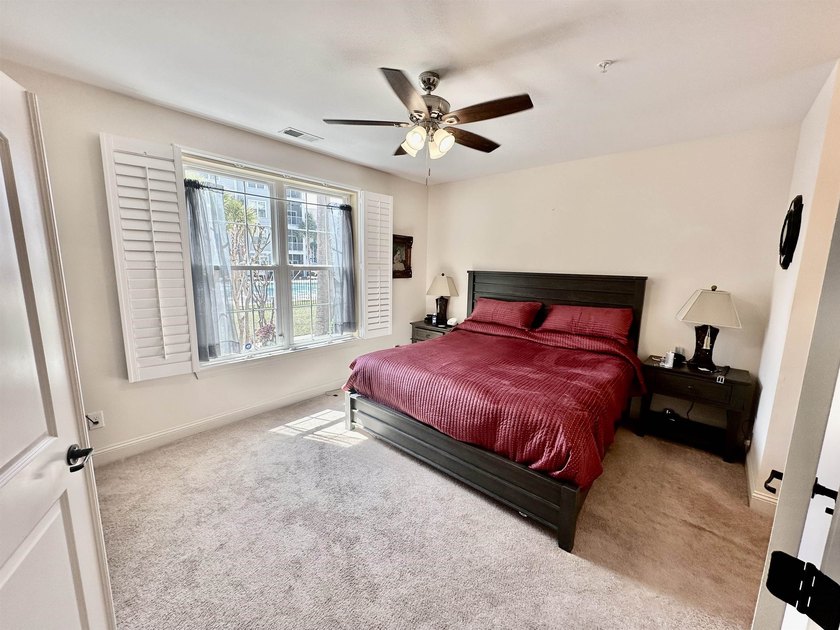 Welcome to this elegant three-bedroom, two-bathroom condominium - photo 14