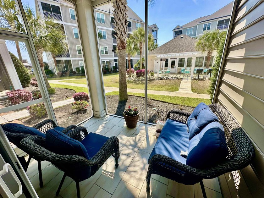 Welcome to this elegant three-bedroom, two-bathroom condominium - photo 17