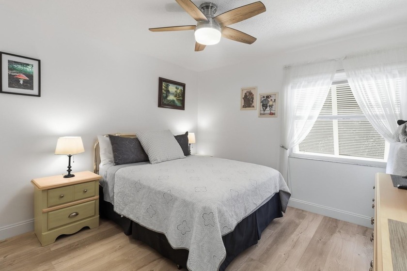 Welcome to this beautifully RENOVATED second-floor condo - photo 17
