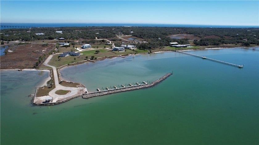 The Landing at Redfish Point is a gated coastal enclave where - photo 9