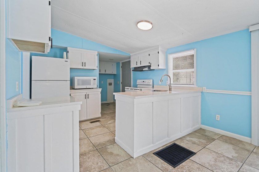 Coastal convenience meets move-in-ready comfort in the heart of - photo 12