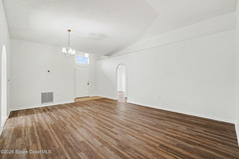 Check out this 3-bedroom, 2-bath home offers a spacious and airy - photo 3