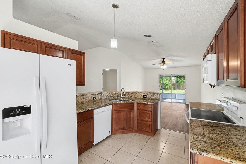 Check out this 3-bedroom, 2-bath home offers a spacious and airy - photo 5