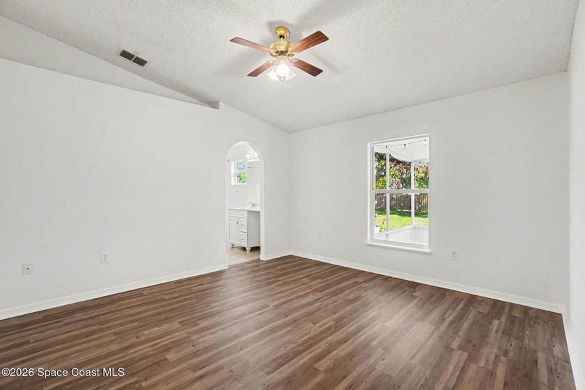 Check out this 3-bedroom, 2-bath home offers a spacious and airy - photo 7