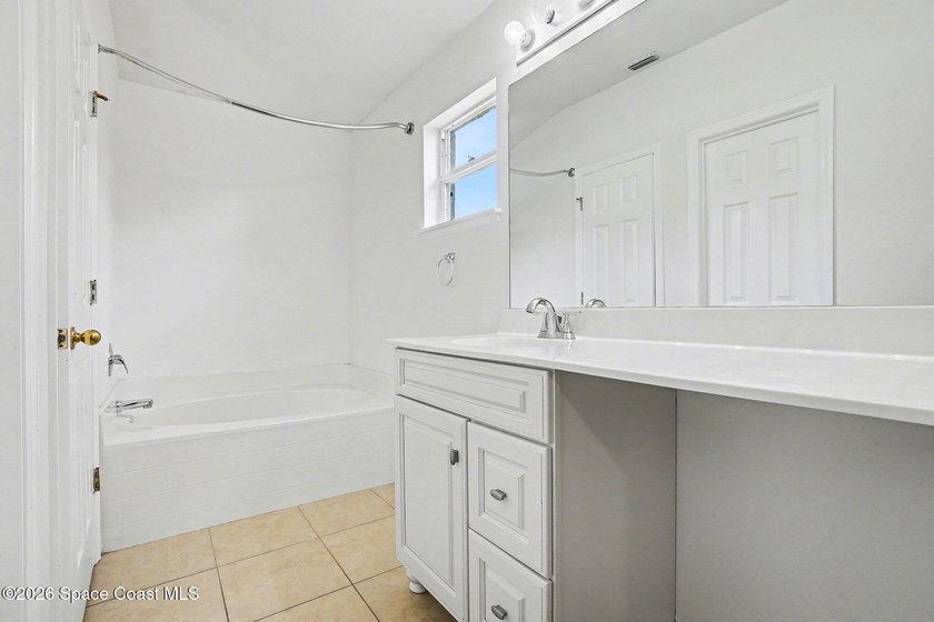 Check out this 3-bedroom, 2-bath home offers a spacious and airy - photo 8