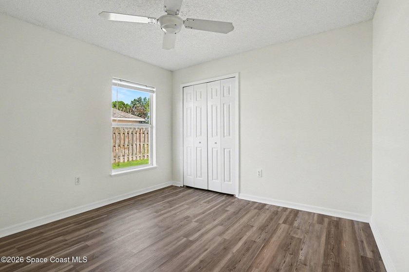 Check out this 3-bedroom, 2-bath home offers a spacious and airy - photo 10