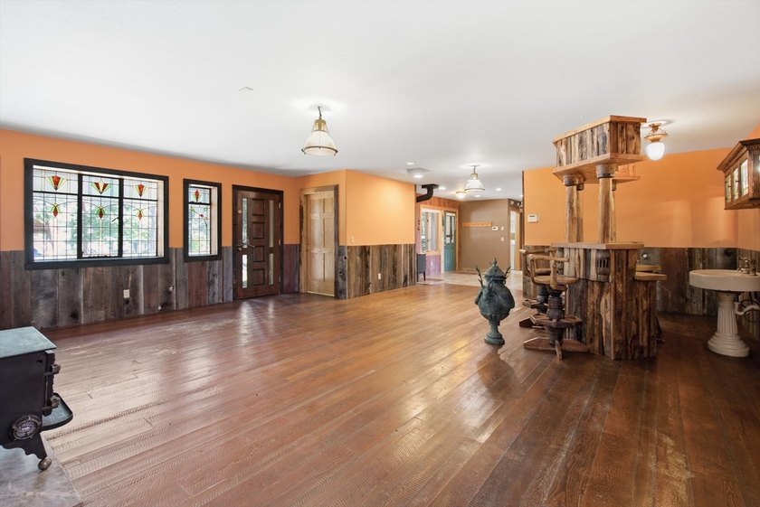 Tucked away on over 7 acres of mature timber, this custom built - photo 9