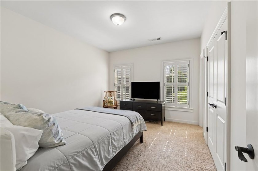 Set behind the gates of One Ivy Walk, this brick townhome offers - photo 32