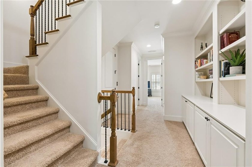 Set behind the gates of One Ivy Walk, this brick townhome offers - photo 34