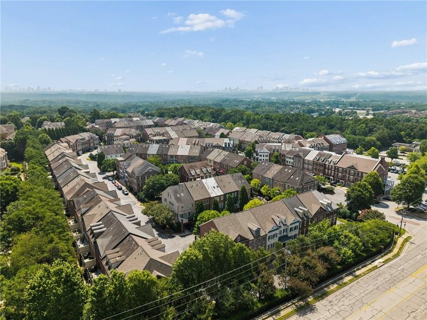 Set behind the gates of One Ivy Walk, this brick townhome offers - photo 42
