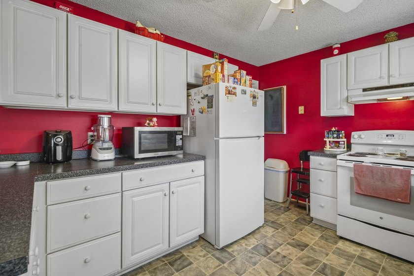 Charming 4-bedroom home situated on a spacious corner lot shaded - photo 12