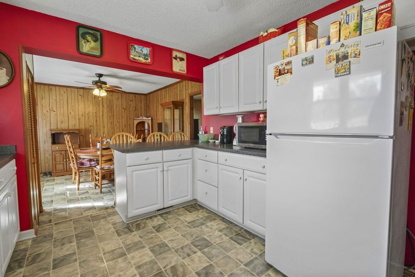 Charming 4-bedroom home situated on a spacious corner lot shaded - photo 13