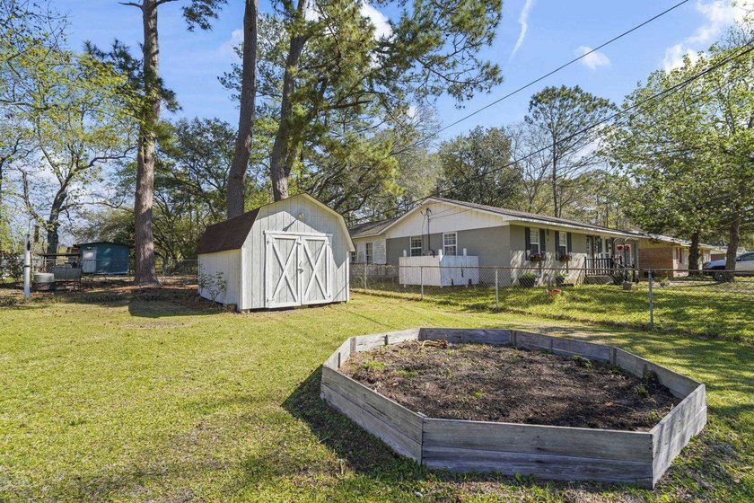 Charming 4-bedroom home situated on a spacious corner lot shaded - photo 34