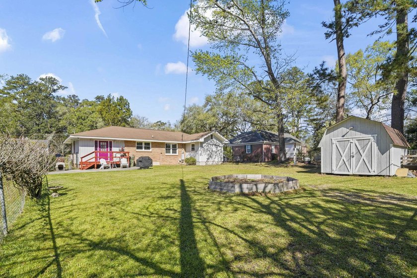 Charming 4-bedroom home situated on a spacious corner lot shaded - photo 35