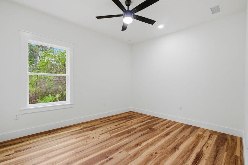 Welcome to 8756 Sand Pine Drive--a truly rare new-construction - photo 35
