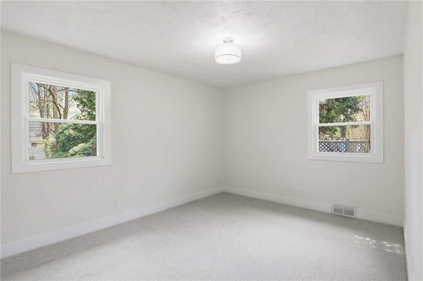 MOVE IN READY 3-bedroom, 1.5-bath ranch with a 1-car garage and - photo 11