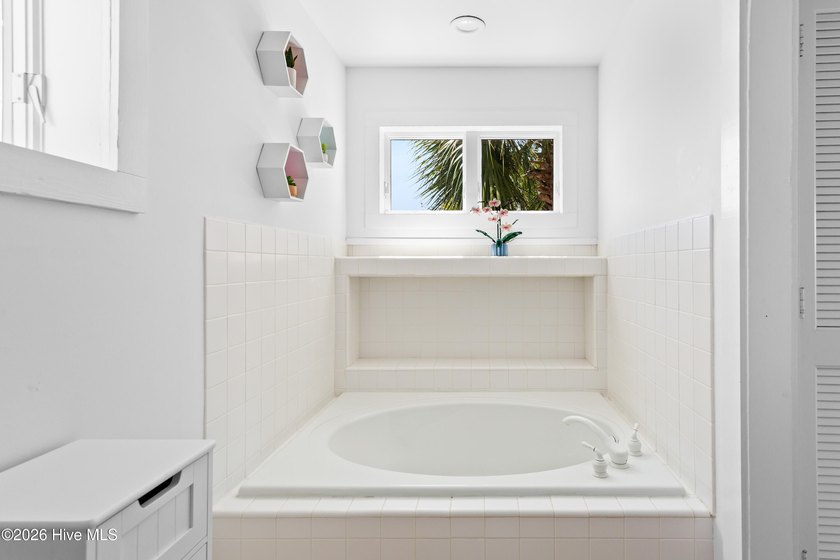 Set on one of Wrightsville Beach's most coveted streets in the - photo 32