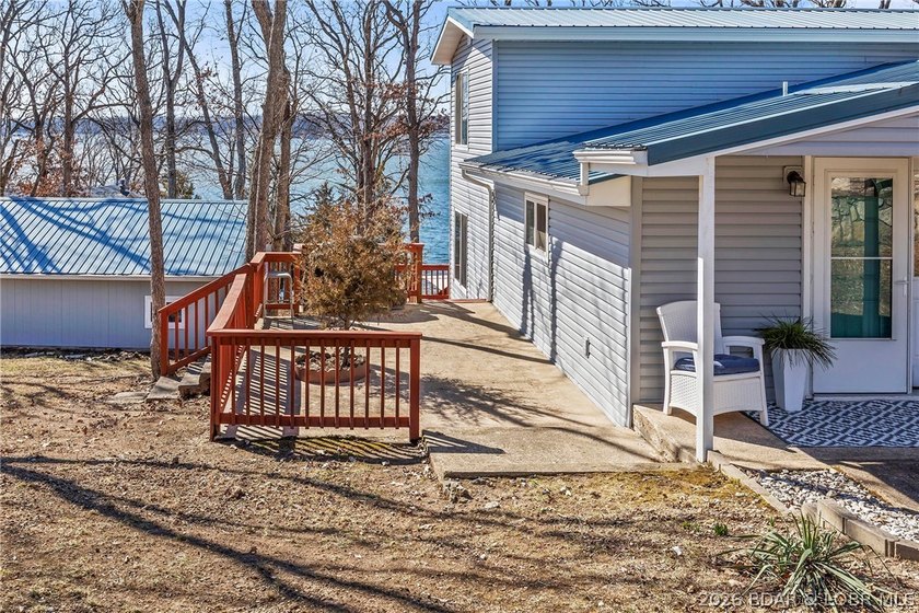 Newer metal roof, gutters &amp; downspouts, newer vinyl siding - photo 41