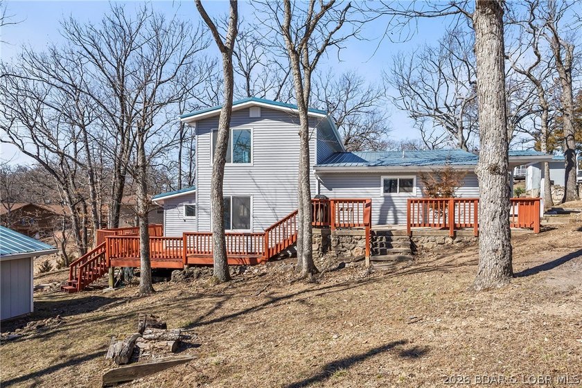 Newer metal roof, gutters &amp; downspouts, newer vinyl siding - photo 45