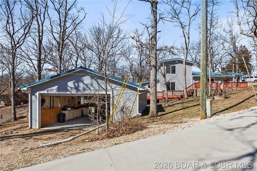Newer metal roof, gutters &amp; downspouts, newer vinyl siding - photo 47