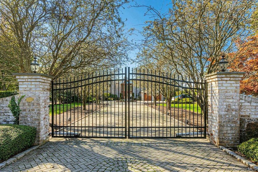 Privately gated, prestigious waterfront home in the heart of - photo 2