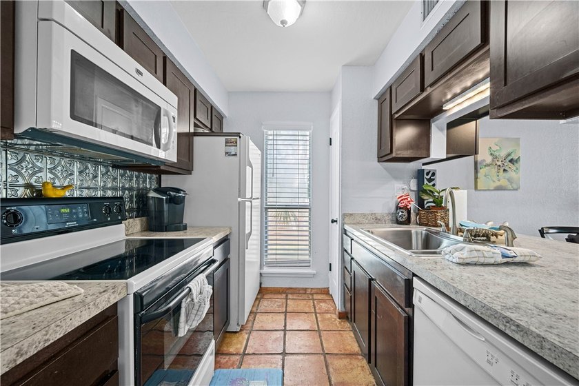 Immaculate, fully furnished 3/2 two story condo. Great views of - photo 2
