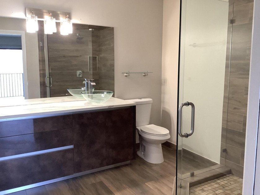 This beautifully renovated 2-bedroom, 2-bathroom townhouse is - photo 11