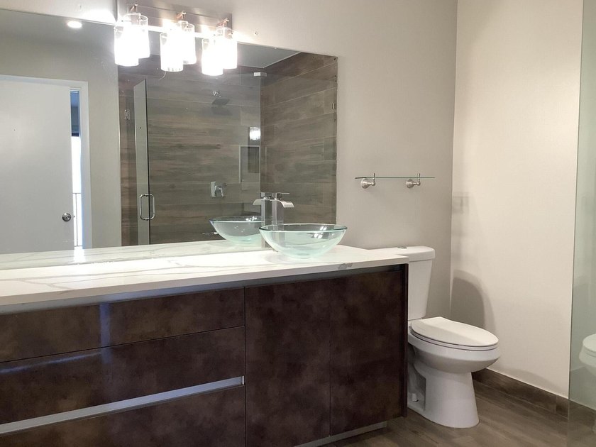 This beautifully renovated 2-bedroom, 2-bathroom townhouse is - photo 12